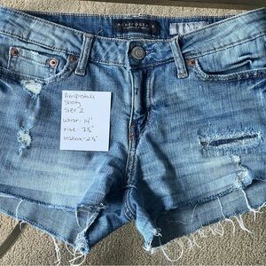 Distressed denim shorts.